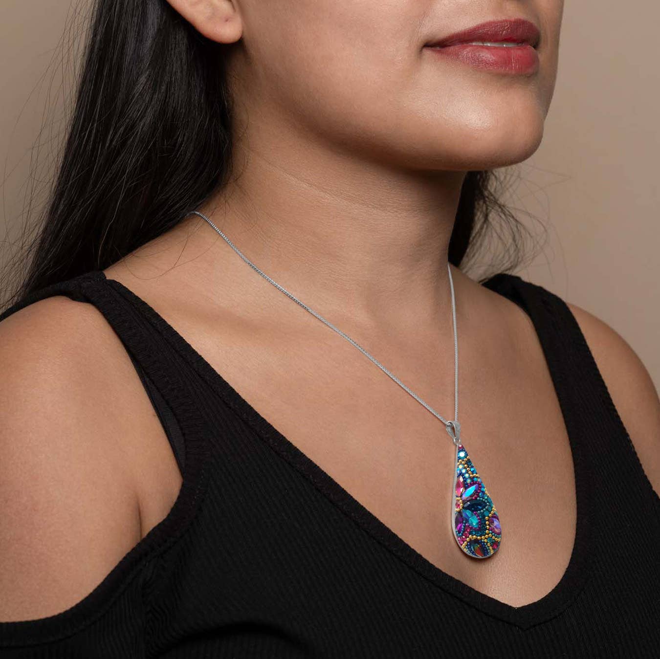 Morning Drop Pendant by Mosaico Jewels, showcasing understated elegance and minimal design that captures the light beautifully.