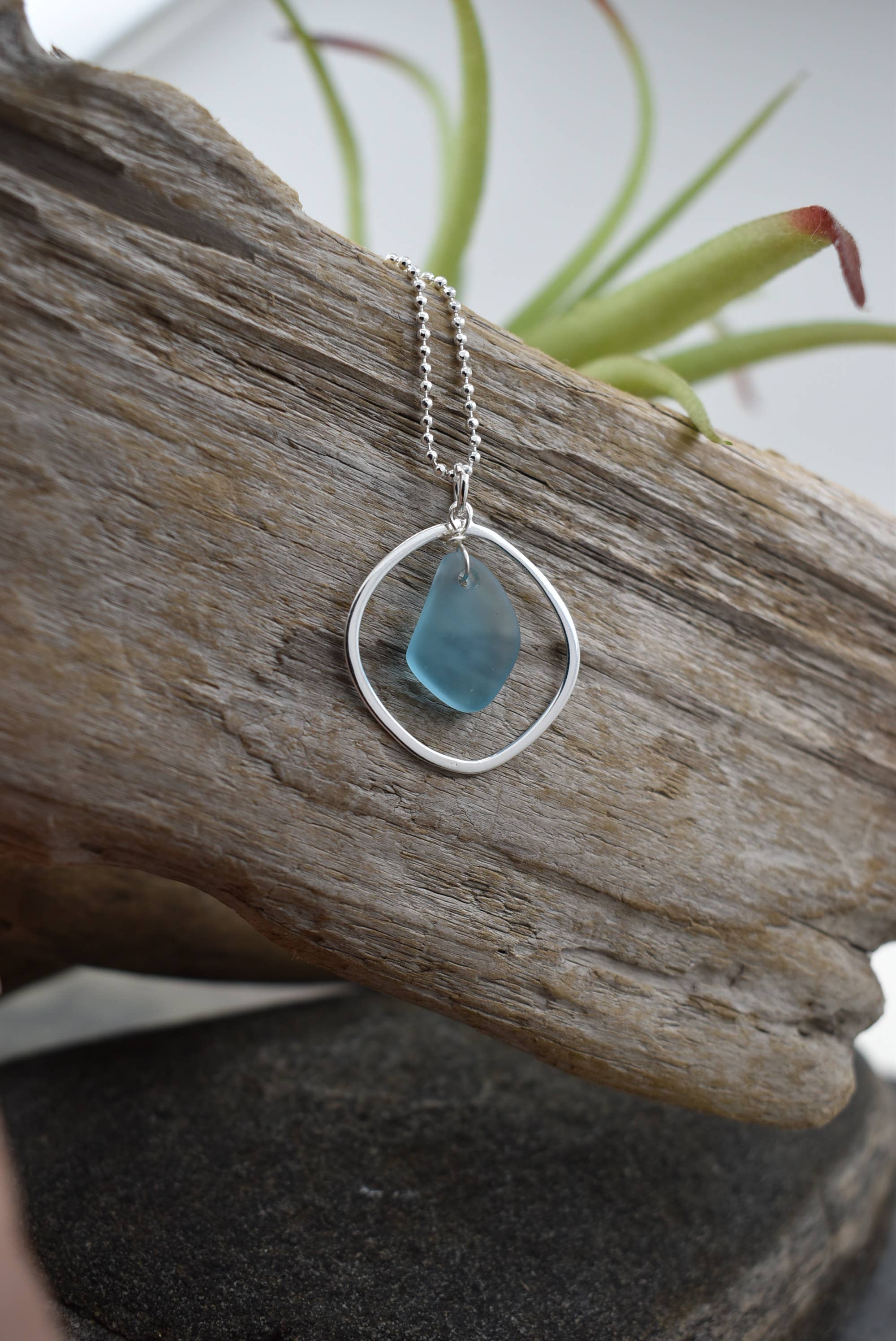 Silver pendant necklace with blue sea glass