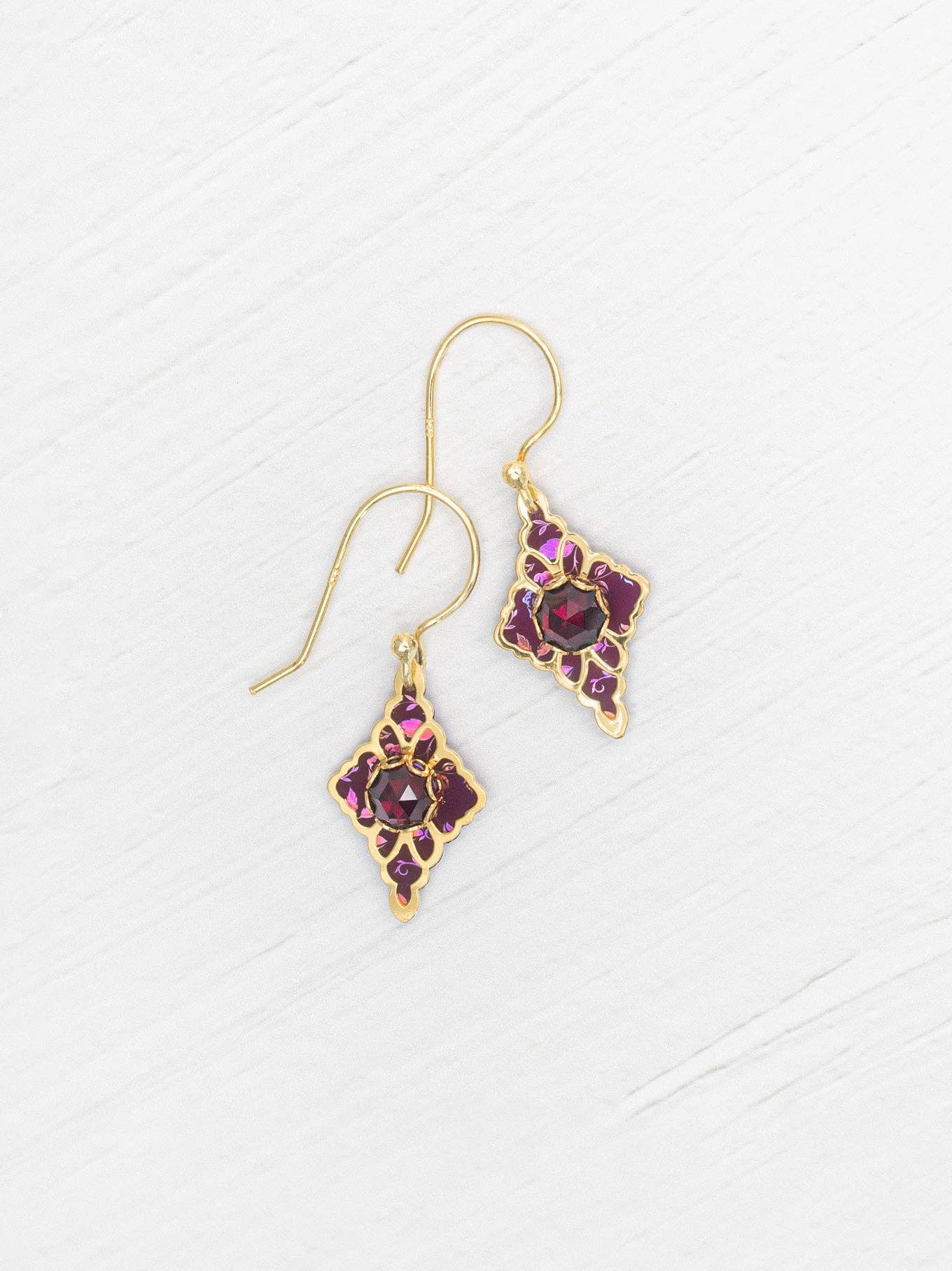 Esme Earrings shining like the stars, perfect for when you need to bring a little sparkle to your life! Can you say 'garnet glam'?!