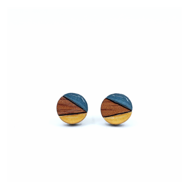 Close-up of color block mini circle titanium earrings showcasing the mustard and navy design, made with durable materials for sensitive ears.
