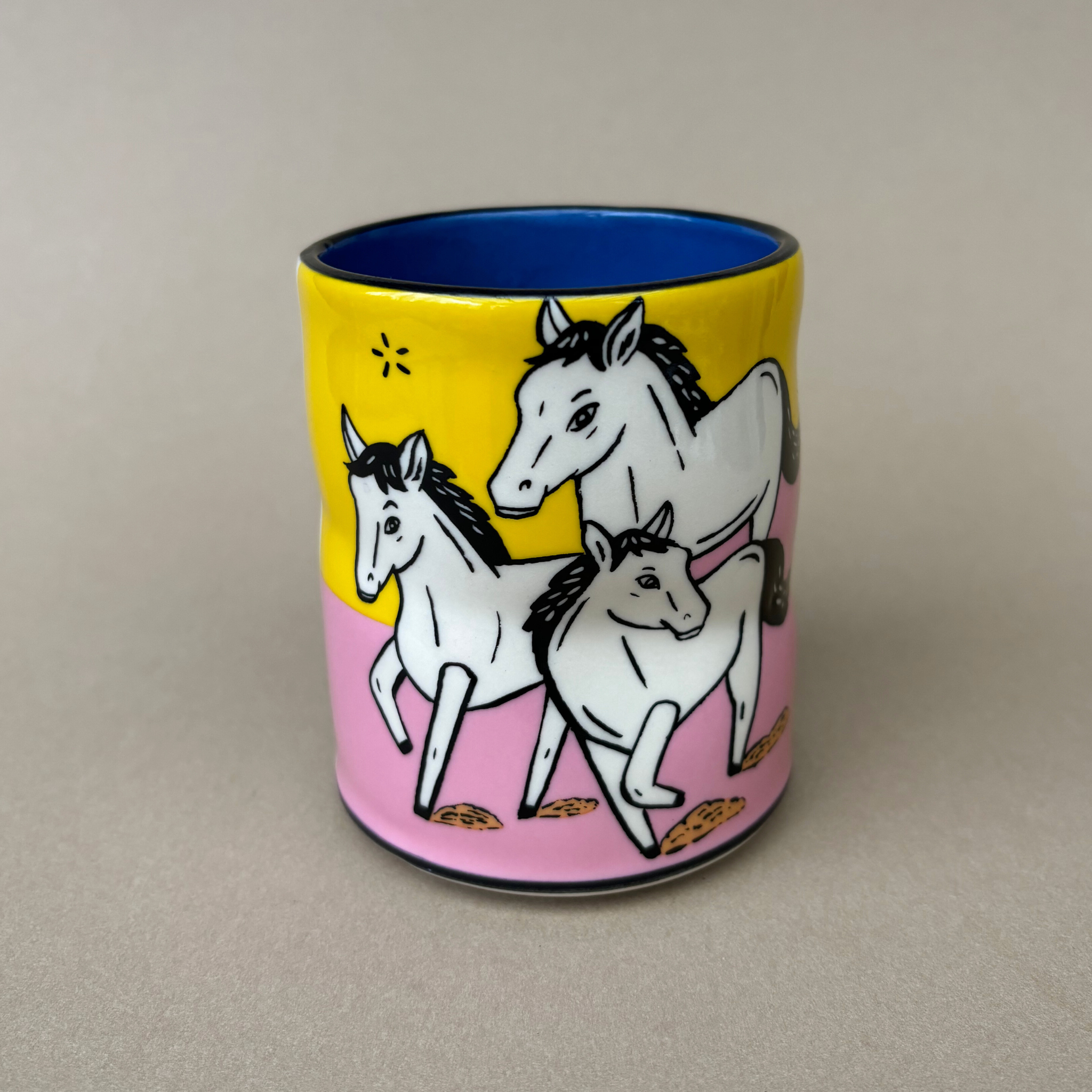 Trust Soul Spark Cup - Large by The Bowl Maker portrays multiple unicorns in a colorful layout, emphasizing a blend of art and function in a beautifully crafted mug.