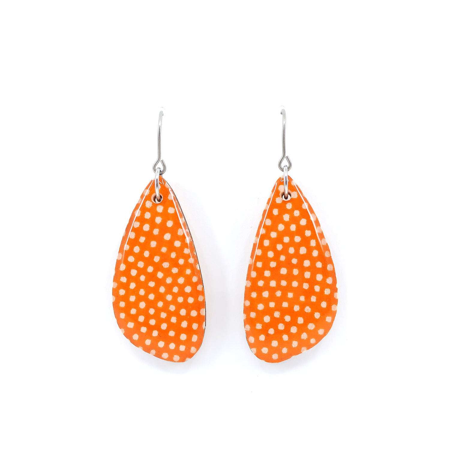 Close-up view of orange Polka dot Japanese Chiyogami wooden earrings showcasing the unique design and titanium wire hook.
