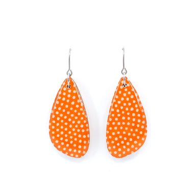 Close-up view of orange Polka dot Japanese Chiyogami wooden earrings showcasing the unique design and titanium wire hook.