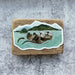 2 otters swimming sticker