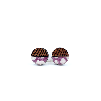 Close-up view of Mini geometric color block titanium studs, featuring UV-cured resin coating and nickel-free titanium posts ideal for sensitive ears.