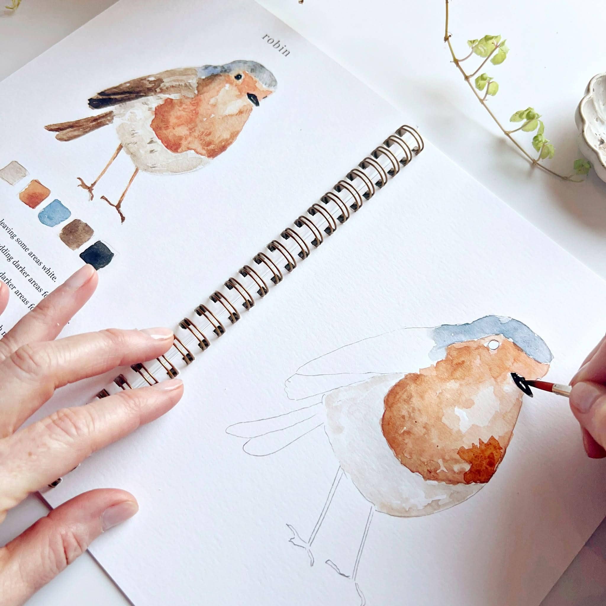 Kids and adults enjoying painting together using the Birds Watercolor Workbook, highlighting the fun and relaxing nature of watercolor art.