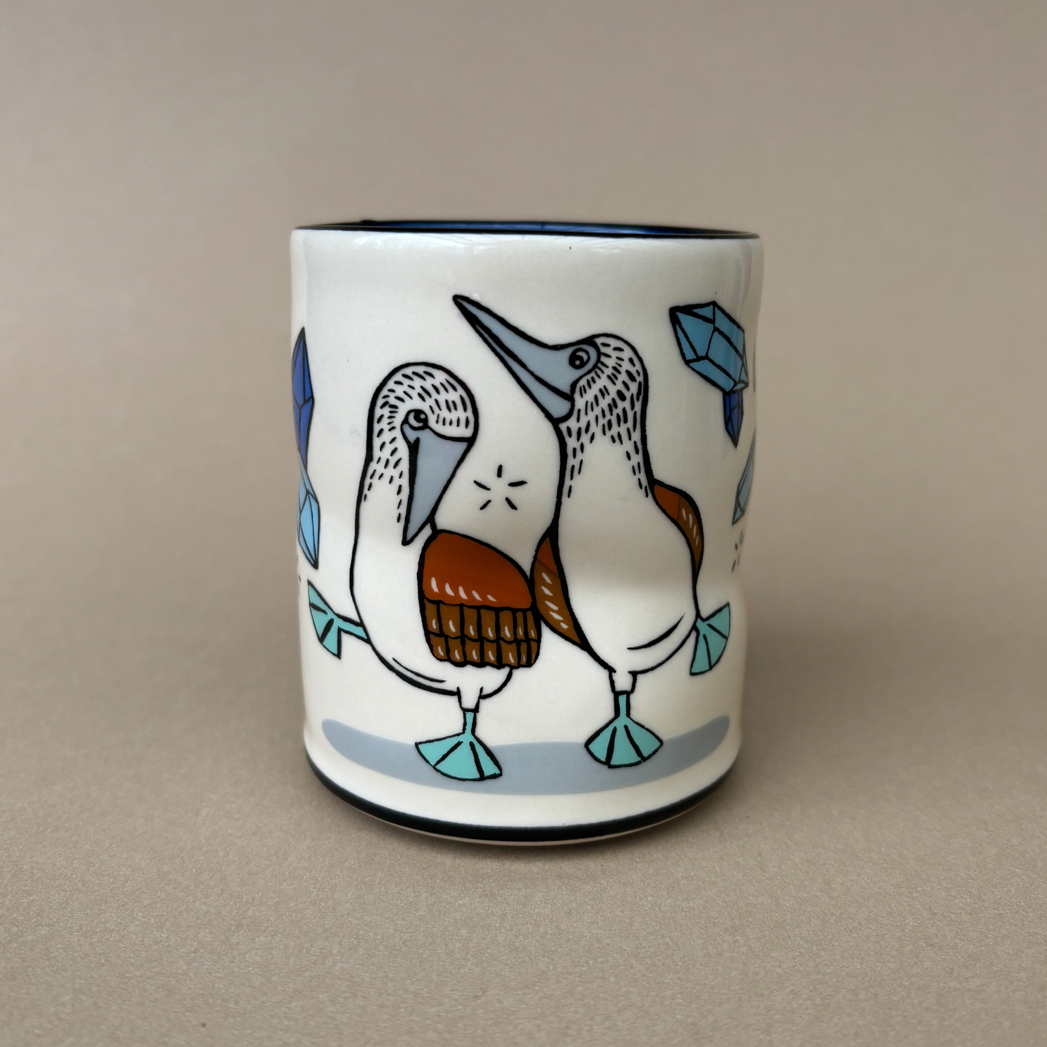 Ridiculous Dance Spark Cup - Large by The Bowl Maker showcasing a detailed drawing of blue-footed booby birds beside sparkling gems.