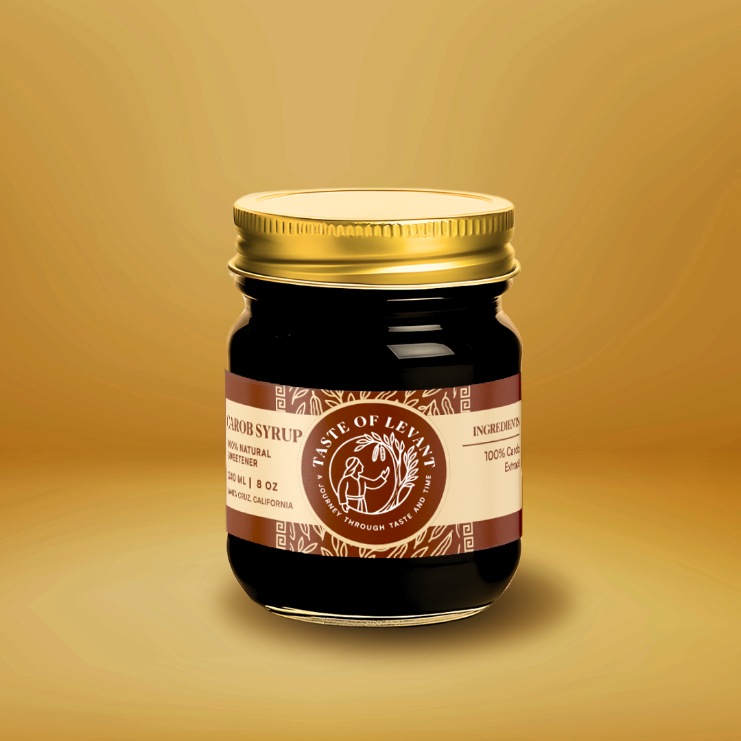 Carob Syrup by First Friday, a golden syrup made from premium carob pods, ideal for drizzling, baking, or blending in your favorite recipes.