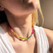 Woman wearing the Desert Hues Beaded Necklace, showcasing the colorful jade beads against her neckline. Handcrafted by The Silver Wren.
