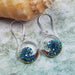 Close-up of Mosaico Jewels Free Wave Earrings showcasing the elegant wave design and sparkling crystals.