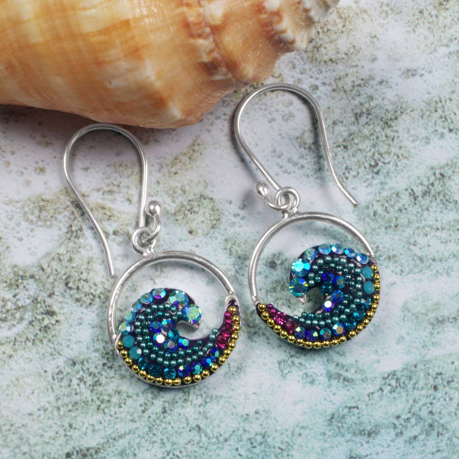 Close-up of Mosaico Jewels Free Wave Earrings showcasing the elegant wave design and sparkling crystals.