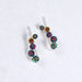Colorful Falling Circles Earrings by Mosaico Jewels, showcasing red, blue, and yellow sparkling details on a silver design.