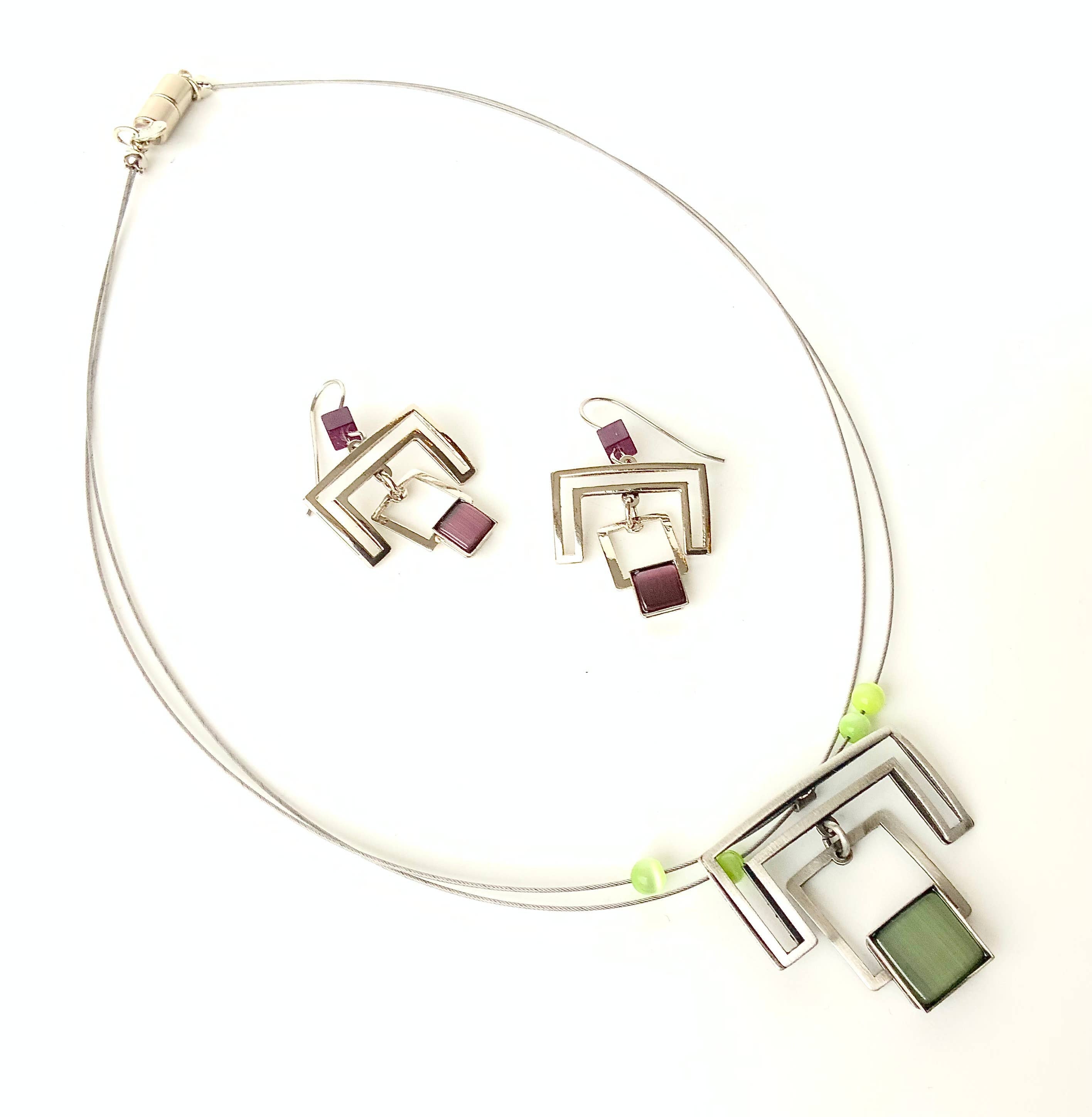 wire necklaces and earrings featuring green beads and acrylic gemstones