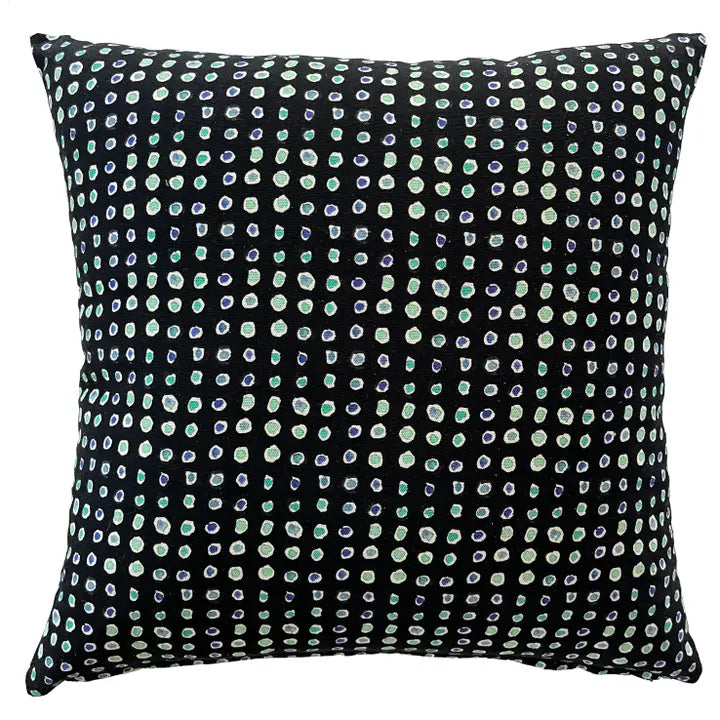 backside of throw pillow black with blue colored circles.
