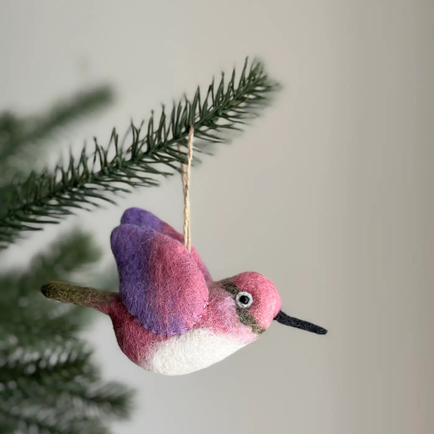 Charming Felt Bird Ornaments hanging on a Christmas tree, adding whimsy and festive cheer.
