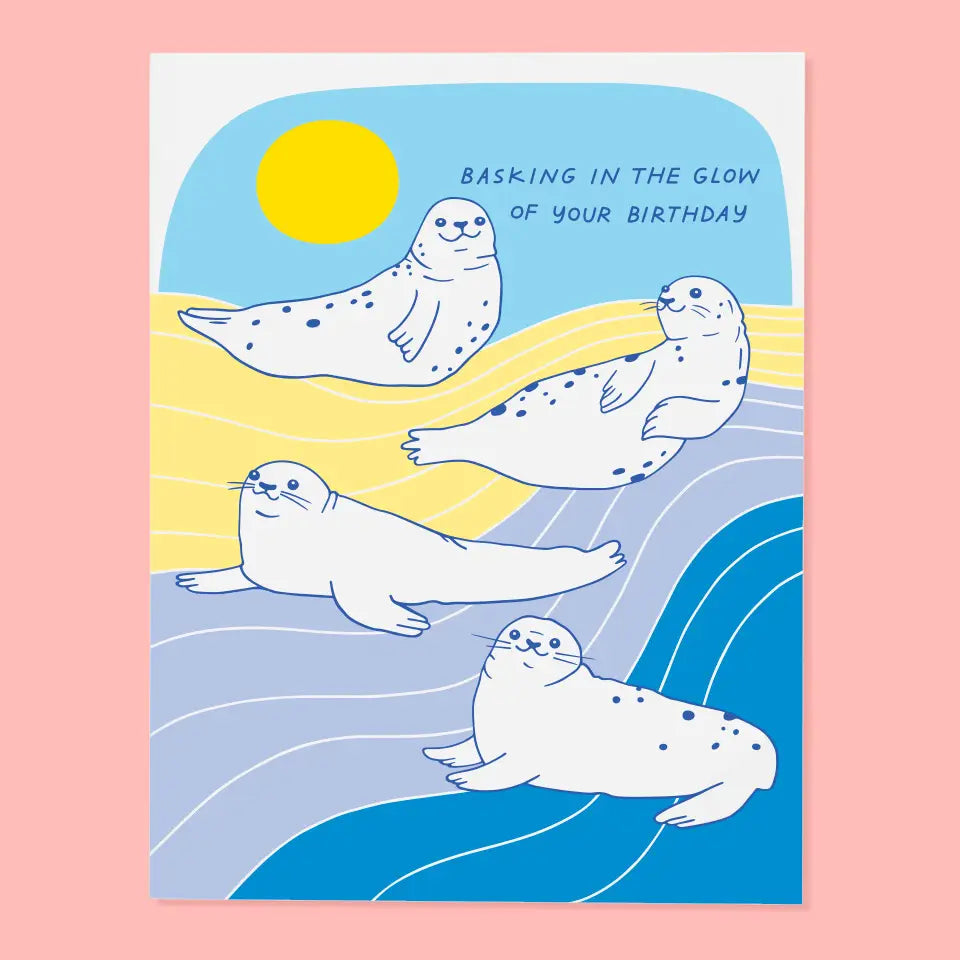 Fun birthday card showing playful seals basking in the sun, designed by The Good Twin. Part of The Good Twin Card Collection.