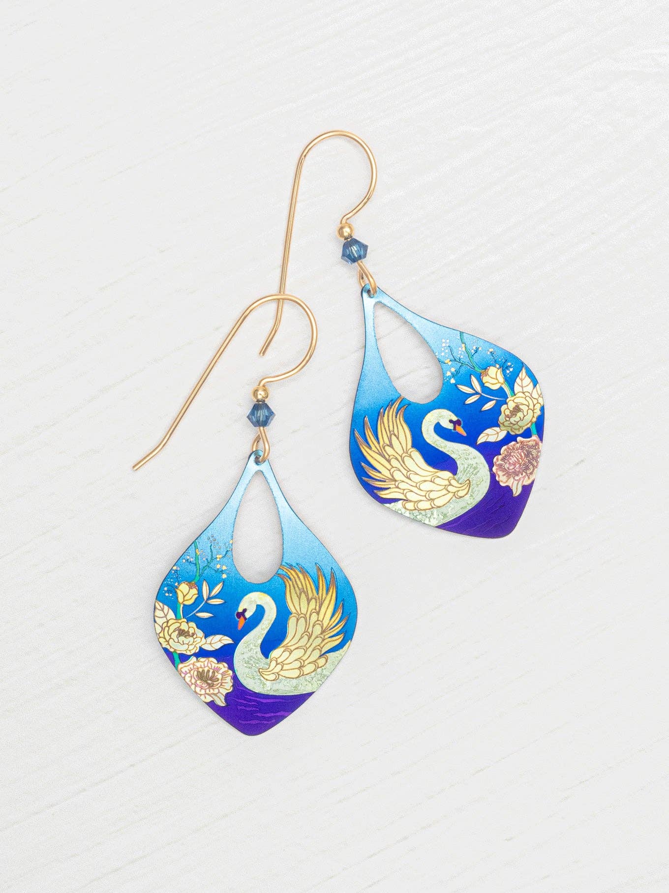 Swan Lake Earrings - A whimsical pairing of hand-painted swans and vibrant florals that make you say 'quack' with style! These earrings will have even the most serious of swans doing a double-take!