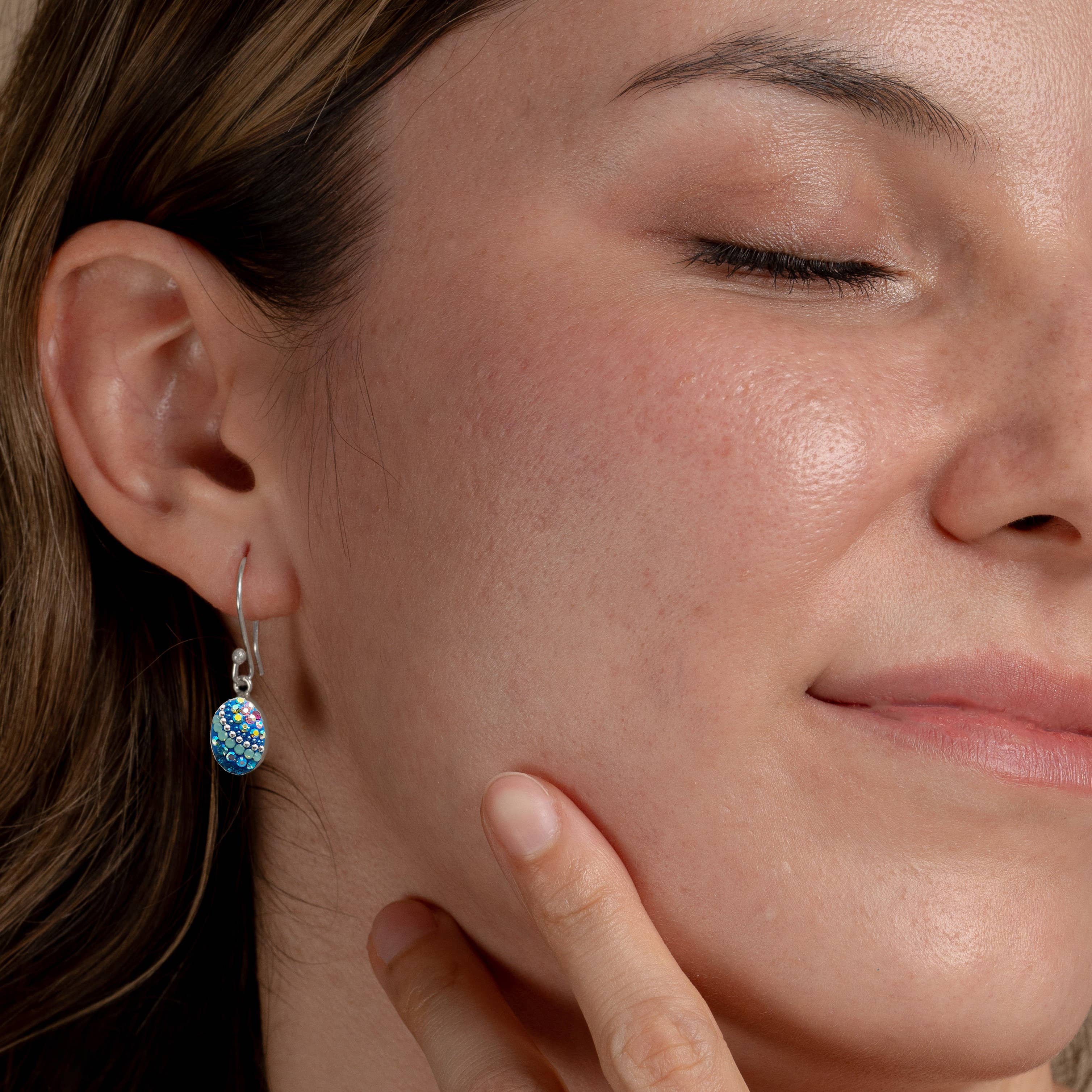 Stunning Crystal & Silver Oval Earrings showcasing delicate craftsmanship, perfect for everyday and special occasions.