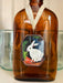 Vintage-style rabbit art locket ornament on a glass bottle