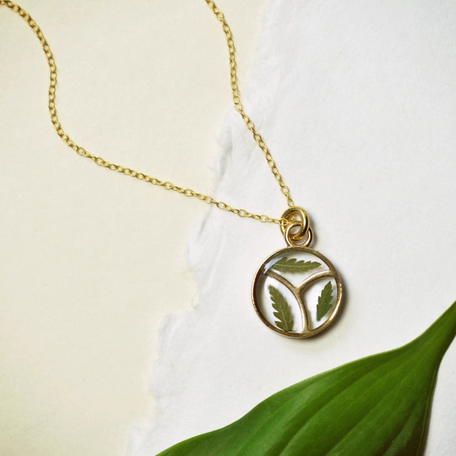 gold pendant necklace with fern