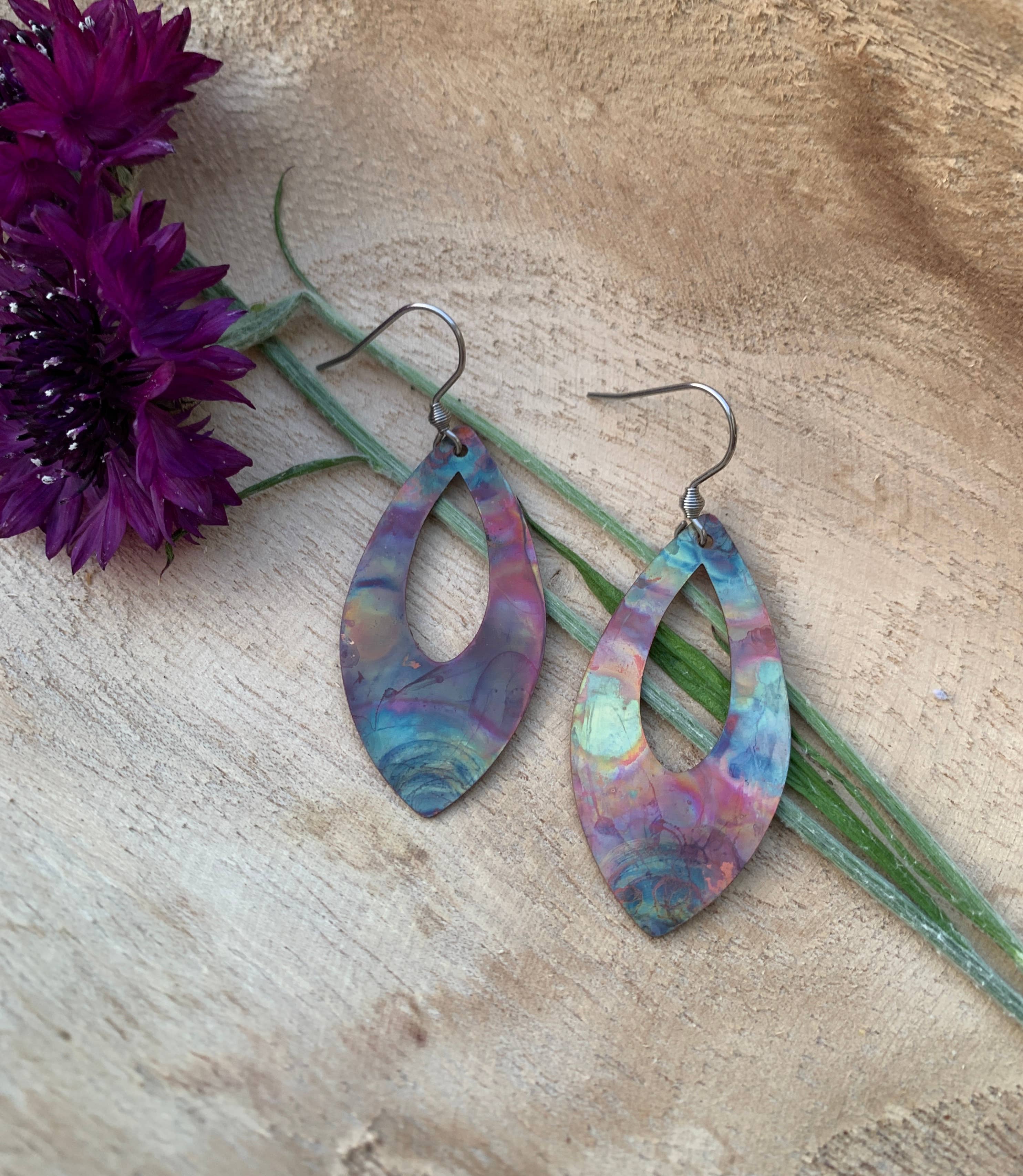 Close-up view of Pointed Teardrop Fire Painted Copper Earrings highlighting their unique shape and colorful design.