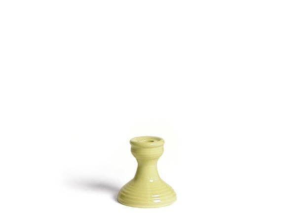 yellow candlestick holder