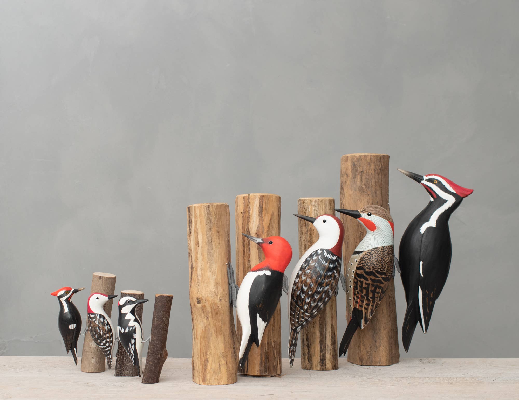 painted woodpecker on wood stump