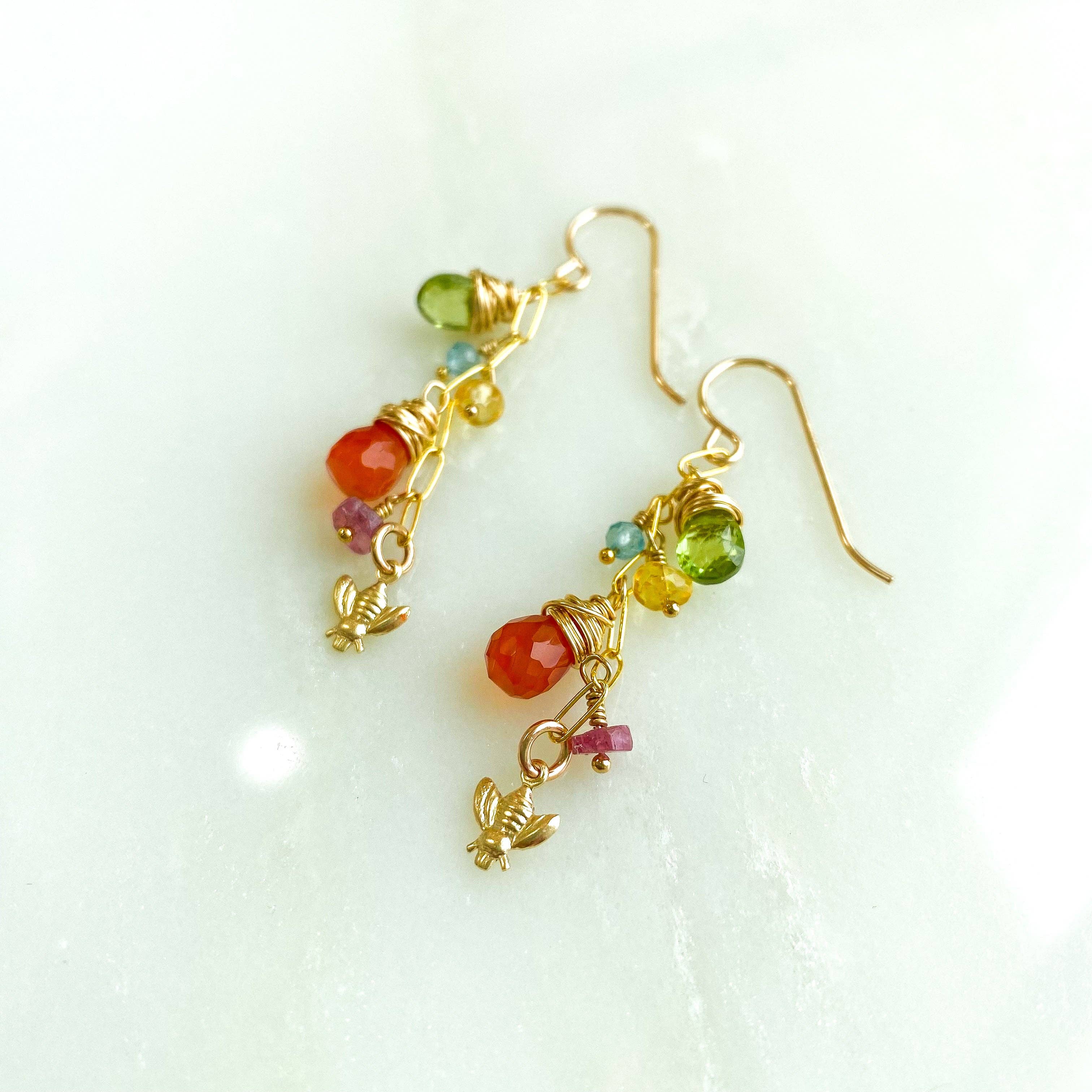 Charming Wildflower Earrings dangling with a trio of colorful gemstones, softly whispering a 'fashion-forward' message while sporting a tiny bee, ready for any outing!