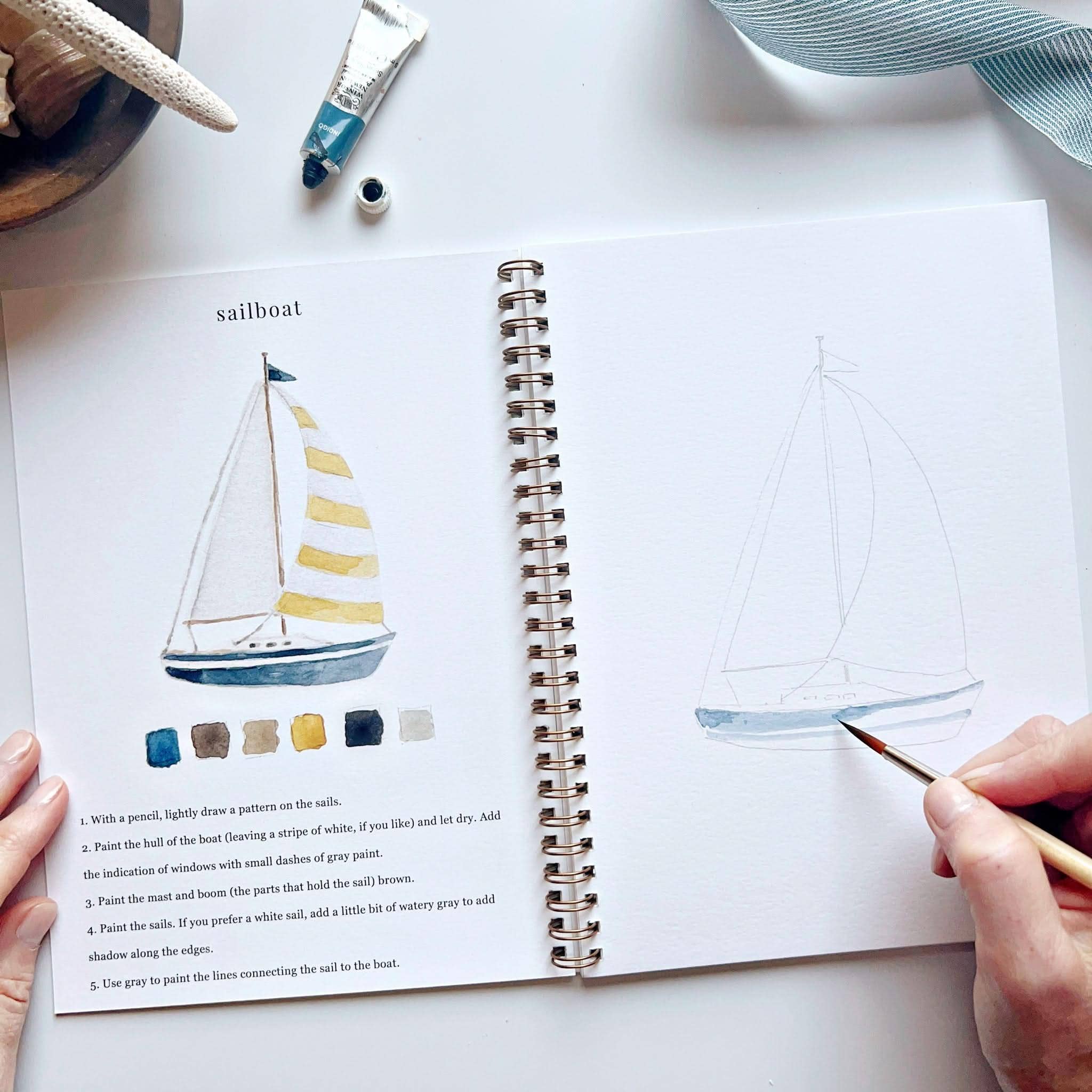 Seaside watercolor workbook cover featuring vibrant illustrations of coastal scenes designed for children and adults alike.