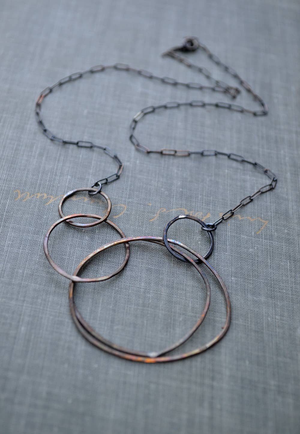 Multi Circle Necklace: Keeping your style fresh and feeling lighter than air! Crafted from textured sterling silver and rustic brass circles, it's the perfect companion for your any day adventures—no heavy lifting required!