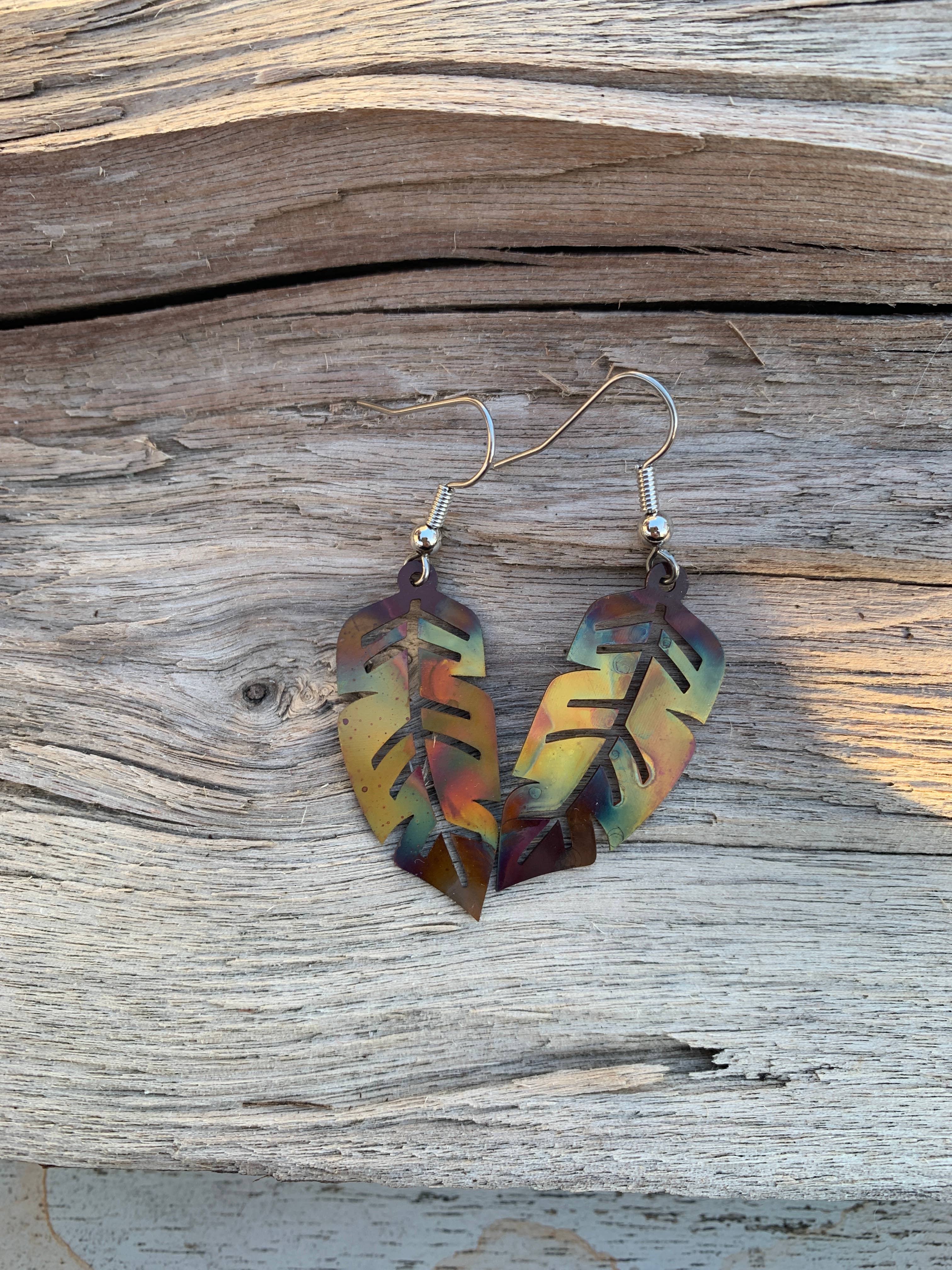 Artistic display of Western Feather Copper Earrings highlighting their vibrant colors and one-of-a-kind style.