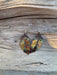 Artistic display of Western Feather Copper Earrings highlighting their vibrant colors and one-of-a-kind style.