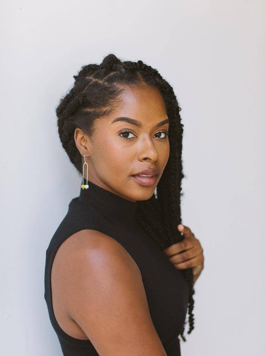 woman wearing bolo earrings