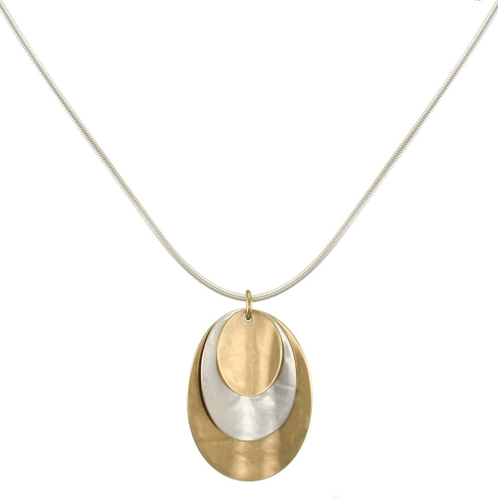 Layered Dished Ovals Necklace featuring three stacked brass and silver ovals on a silver snake chain, showcasing a unique concave design.