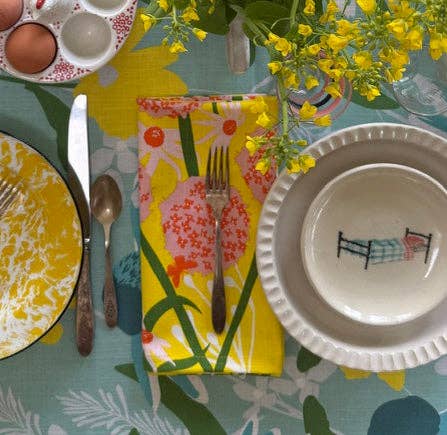 Allium Napkin Set laid out on a table, adding a touch of sunshine and fun to your mealtime setting.