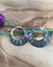 Display of Boho Large circle earrings on card, depicting stunning copper design and protective coating for lasting beauty.
