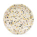 Crow Canyon Home Catalina Enamelware Coupe Dinner Plate exhibiting a playful speckled design with pastel pink, black, and yellow dots on a cream surface.