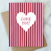 Valentine's Day Card Collection featuring a pink striped design with a heart shape and the text 'LOVE YOU' by ARTISANS & agency.