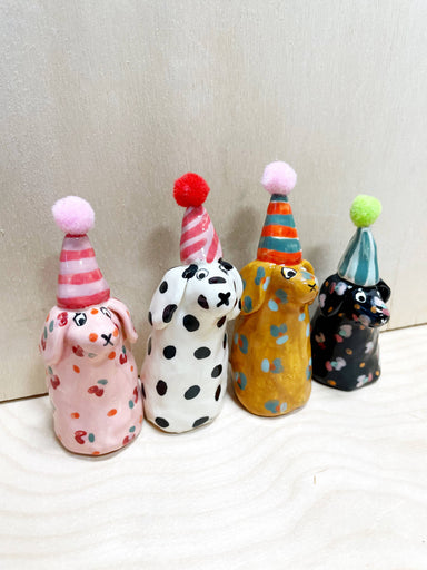 Colorful collection of mini party dogs in party hats, handcrafted by Bianca Rae, featuring playful designs with polka dots and stripes, titled 'Party Minis!'