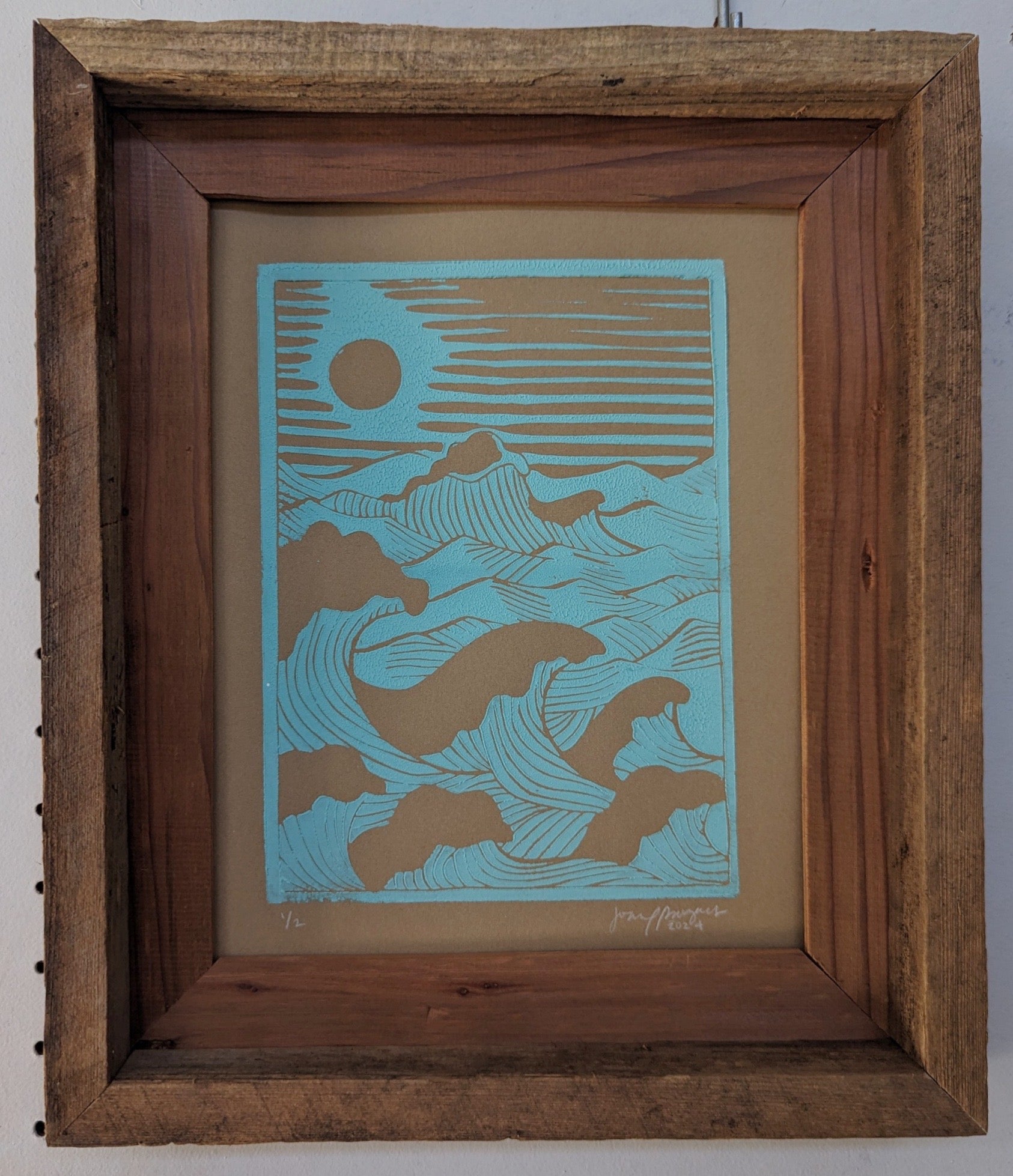 blue rolling waves lino print in wood frame