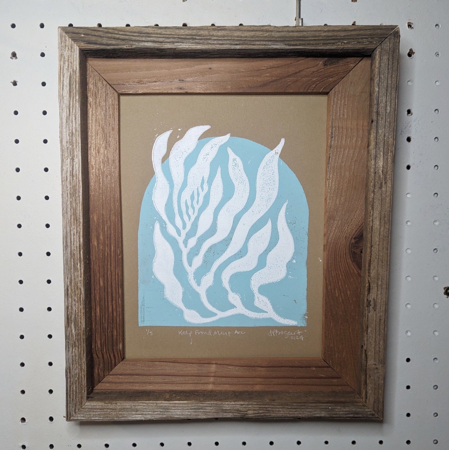 kelp forest lino print in wood frame