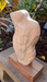 Hearts for the Arts | Stone Lover sculpture by Michael Bashista displayed on a wooden stand, showcasing a smooth, abstract form with a light beige and gray marble texture.