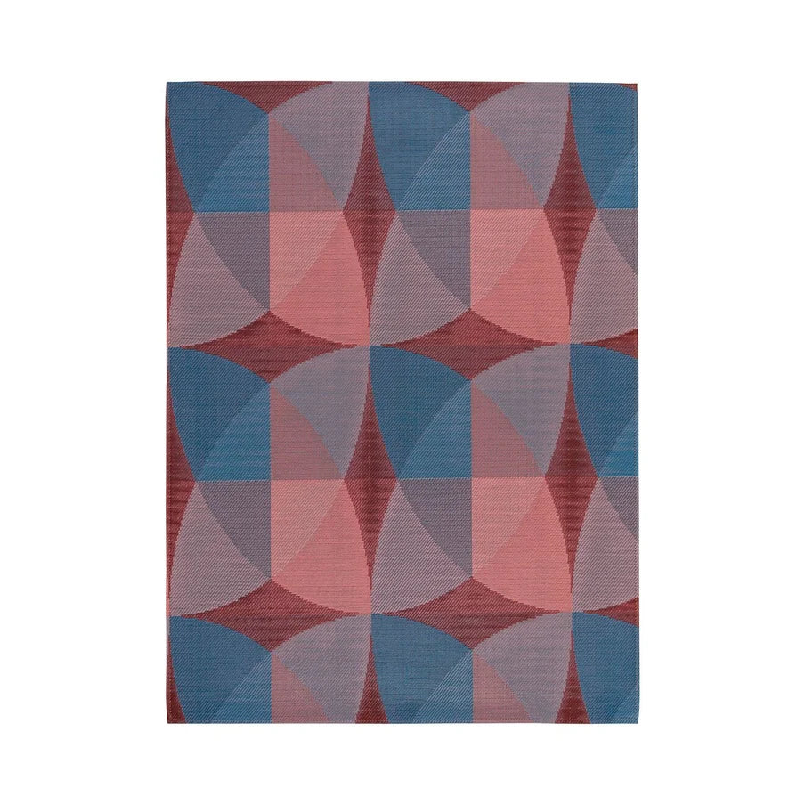 Chilewich Canopy Woven Floor Mat | Raspberry featuring a geometric petal pattern in multitone raspberry hues