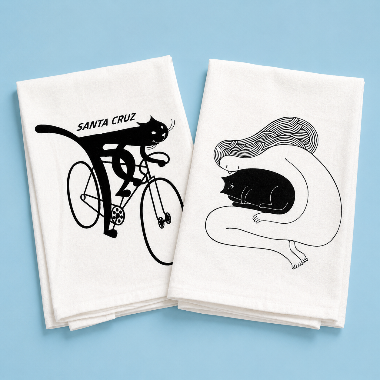 Doug Ross Tea Towel featuring playful cats ready to tackle spills with style and humor.