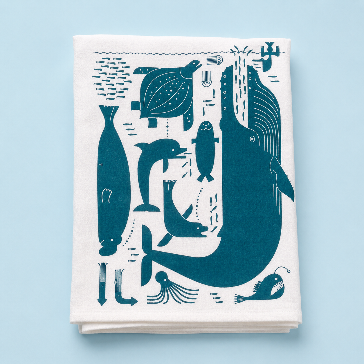 Charming Doug Ross Tea Towel with playful whales & seals, your new witty kitchen companion that dries glassware while making every meal a splash of fun!