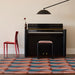 Chilewich Canopy Woven Floor Mat - Raspberry in a piano room