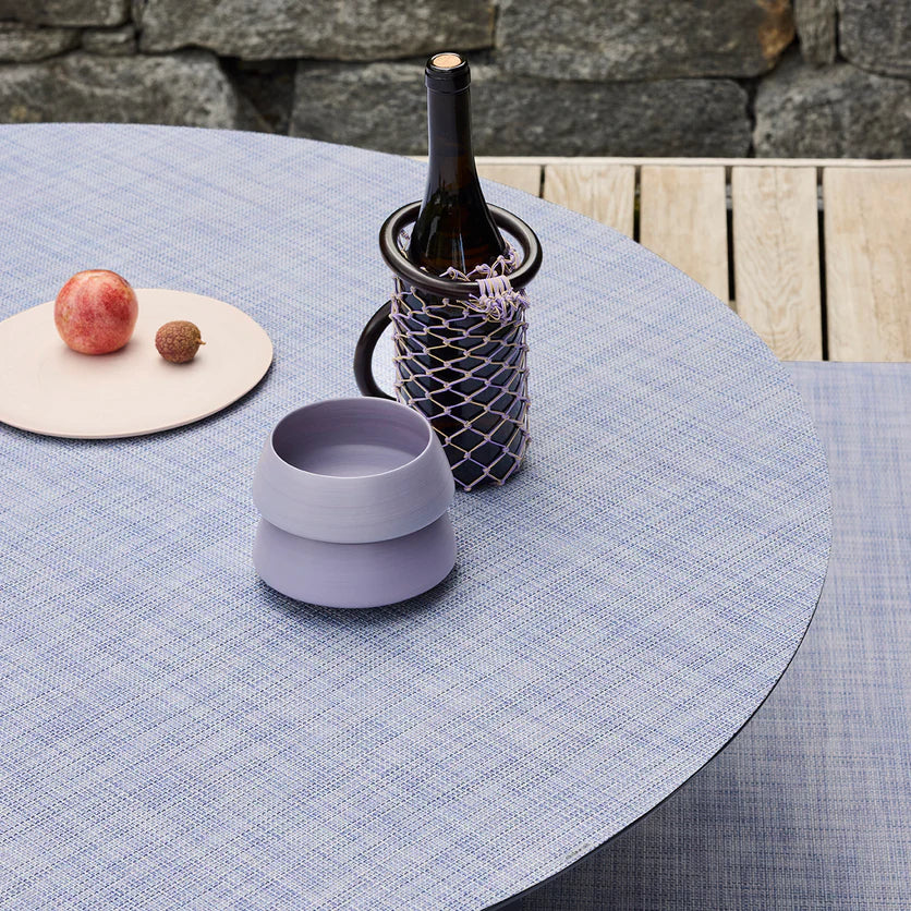 Chilewich Mini Basketweave Woven Floor Mat - Periwinkle on a dining table with wine