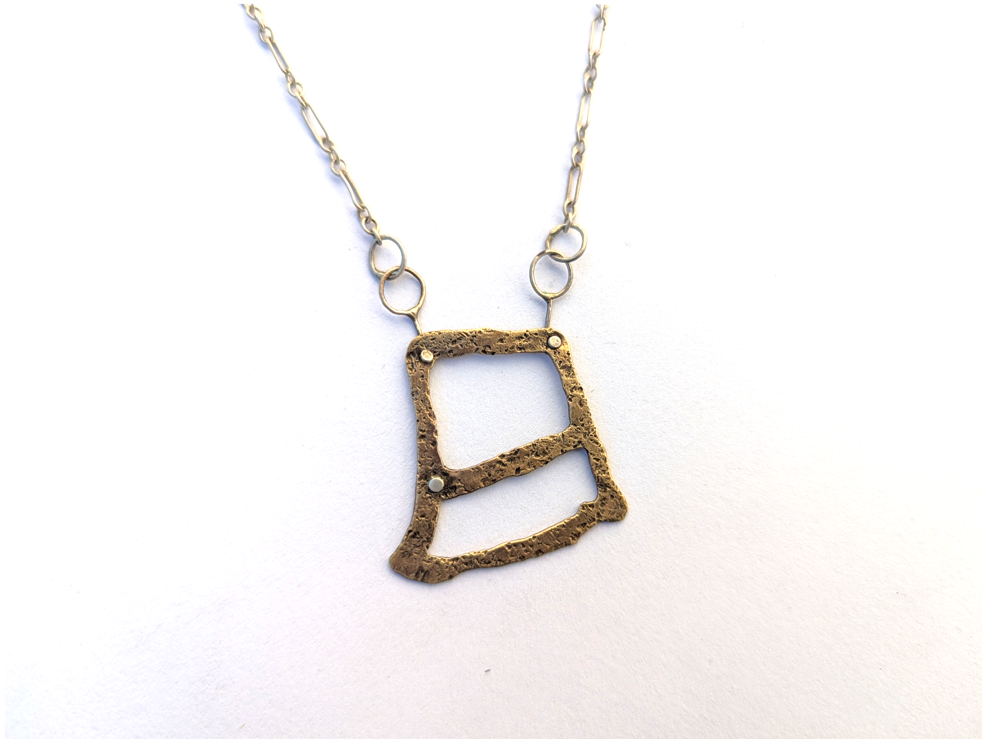 Abstract Pendant with Chain and Brass Designs