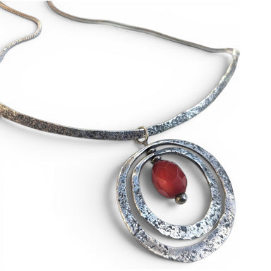 Sterling Silver Necklace and Pendant featuring a beautifully crafted Antique Amber Bead by jewelry artist Deb Collins, showcasing unique organic shapes.