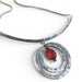 Sterling Silver Necklace and Pendant featuring a beautifully crafted Antique Amber Bead by jewelry artist Deb Collins, showcasing unique organic shapes.